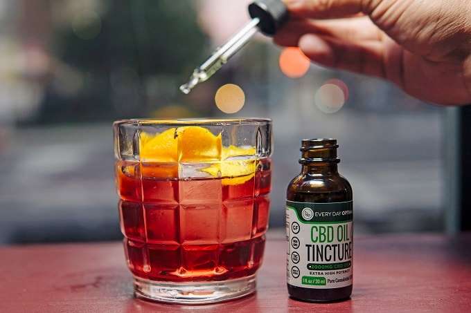 Pouring CBD In Drink
