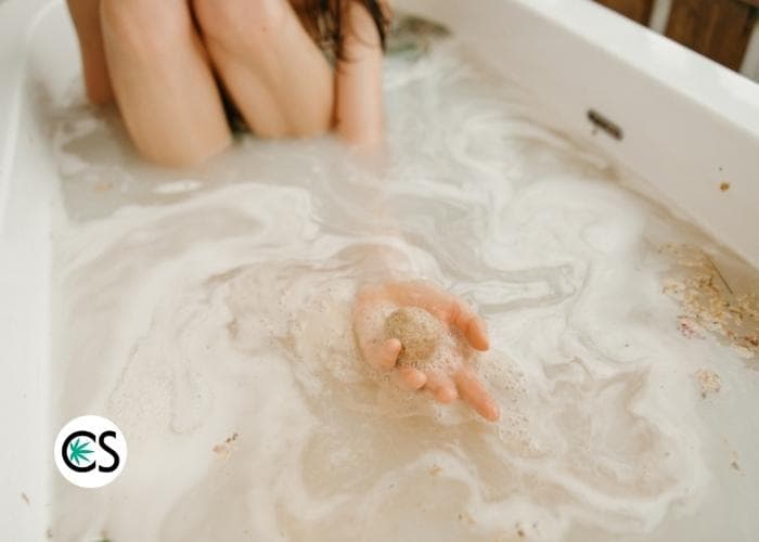 woman enjoying a cbd bath bomb bath